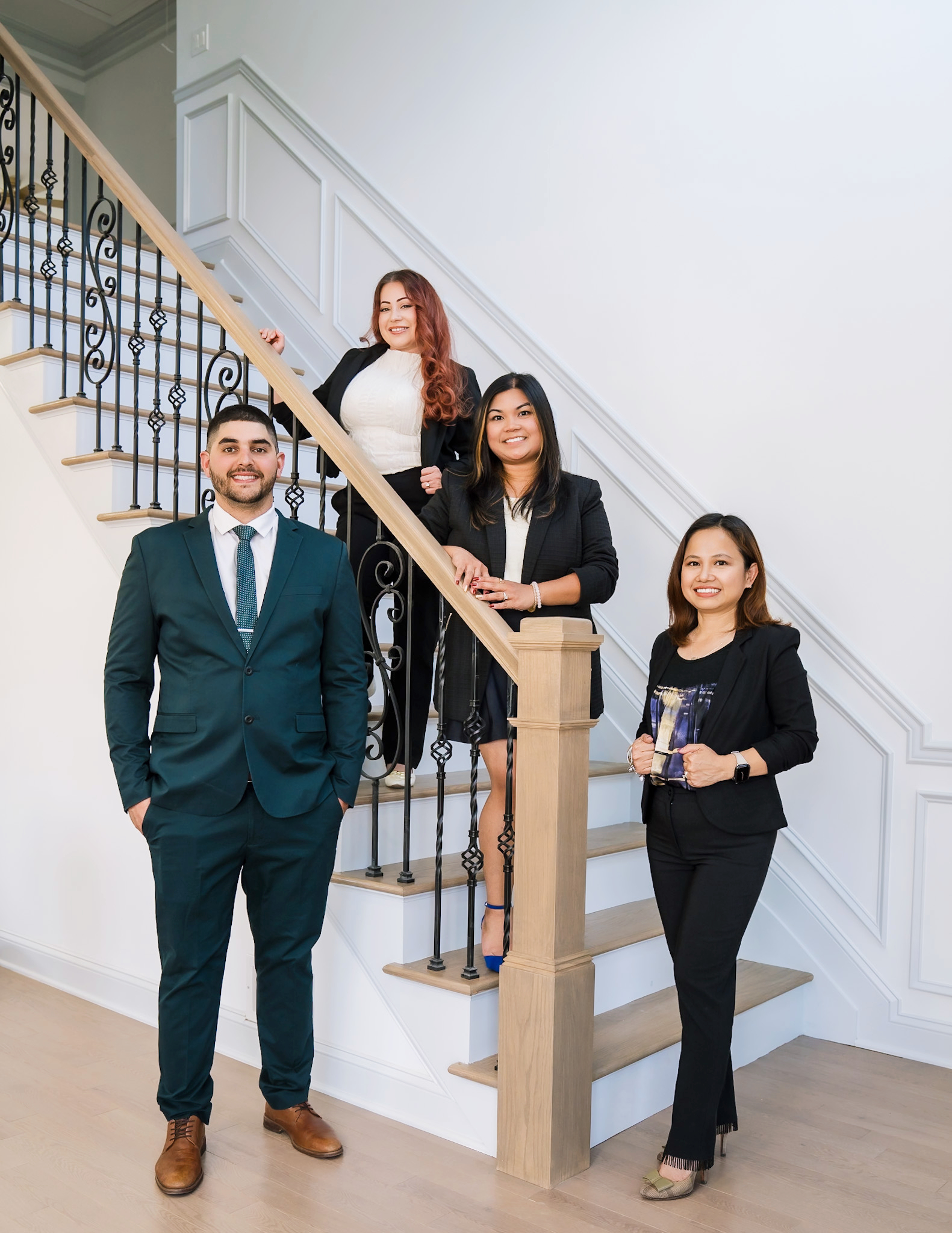 The Magsino Group team on the stairs at a Somerset County listing